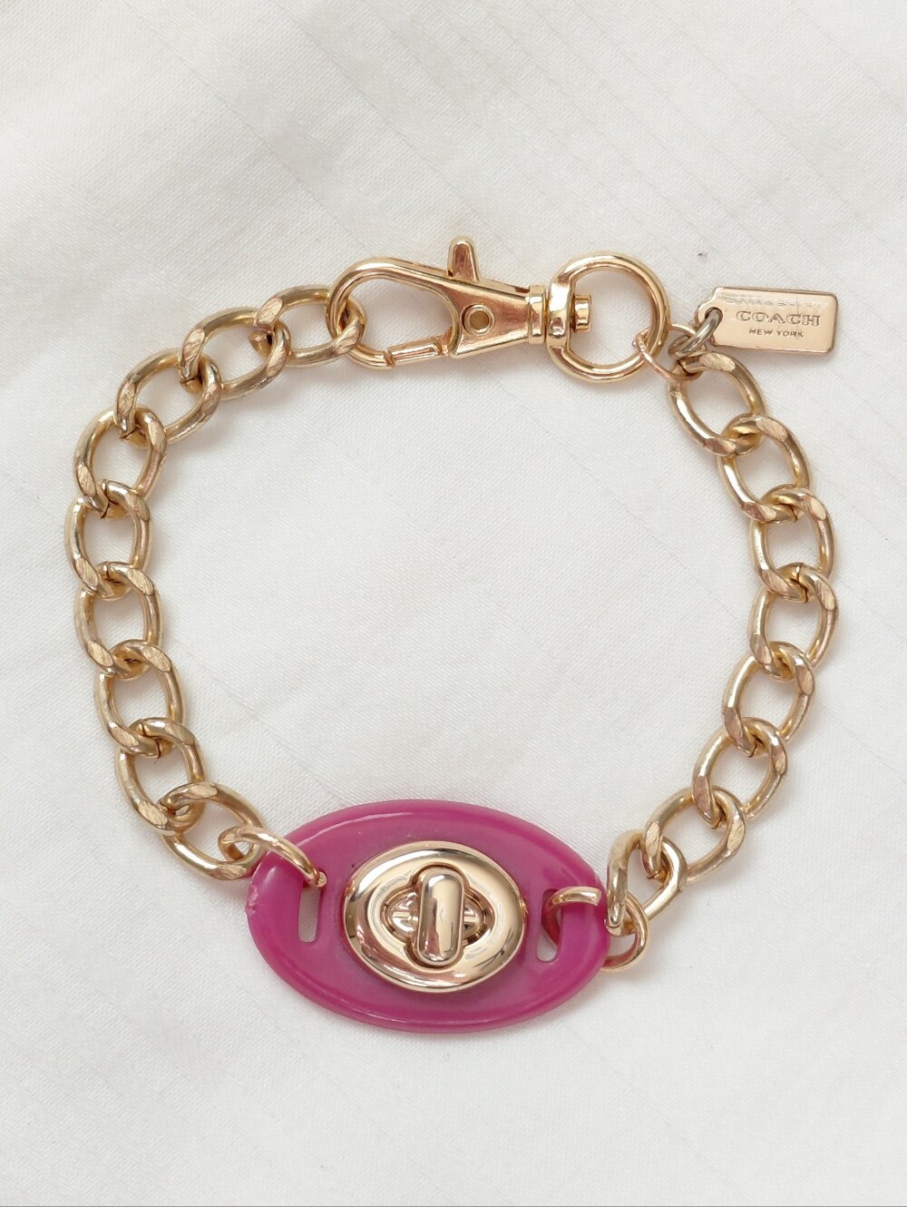 Coach Gold Pink Turn Lock Bracelet